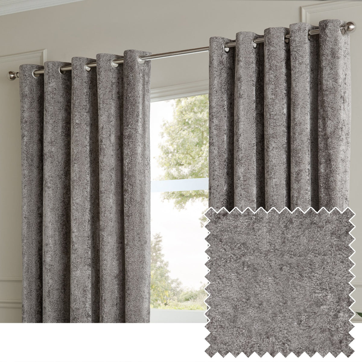 Lustre Velvet Plain Fully Lined Eyelet Curtains in pewter grey, crushed velvet fabric with metallic sheen, hung on a chrome pole in a living room window setting.