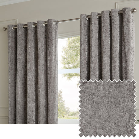 Lustre Velvet Plain Fully Lined Eyelet Curtains in pewter grey, crushed velvet fabric with metallic sheen, hung on a chrome pole in a living room window setting.