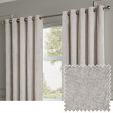 Lustre Velvet Plain Fully Lined Eyelet Curtains in silver, shown hung on a metal pole beside a window, with a fabric swatch inset showing the velvet's low-sheen texture.