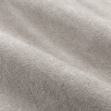 Close-up of Lustre Velvet Plain Fully Lined Eyelet Curtains in silver, showing the soft-pile fabric texture with subtle sheen and gentle folds.
