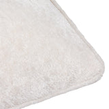 Close-up of the Lustre Velvet Plain Polyester Cushion in ivory, showing the crushed velvet pile texture and stitched corner edge on a white background.