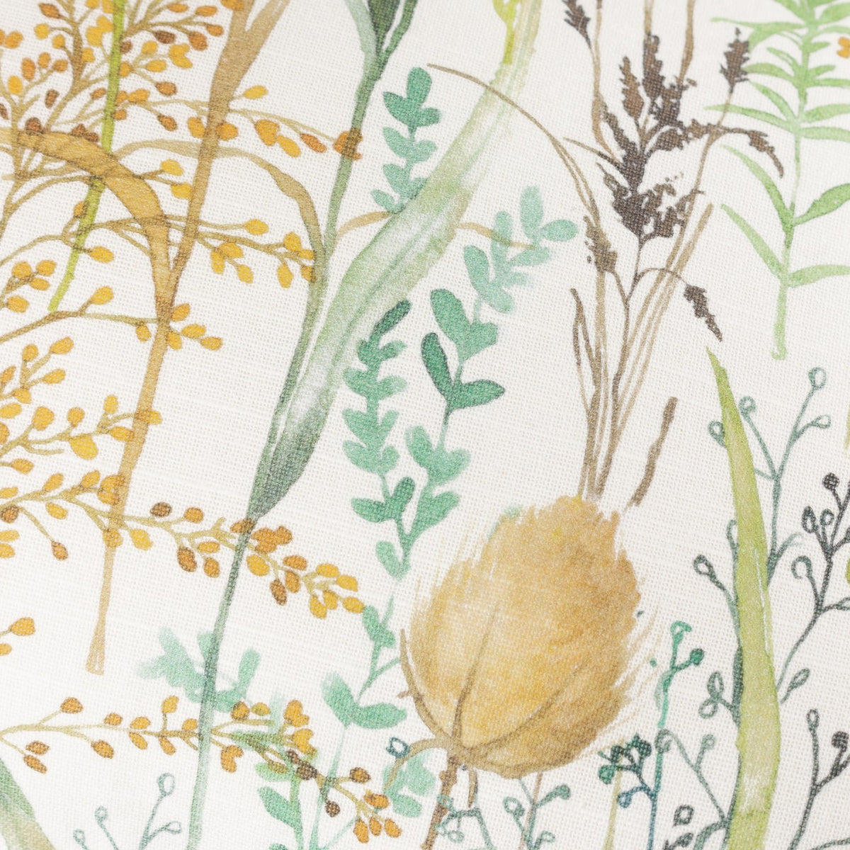 Close-up of the Lydiard linen cotton cushion in Moss, showing a hand-painted watercolour meadow print with wild grasses, seed heads and teasels in green, amber and brown tones.