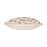 Side view of the Maeve Animal Cotton Cushion in natural, a rectangular bolster with tufted leopard-print spots in beige on a plain cotton base, shown against a white background.