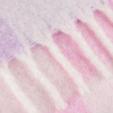 Close-up of the Maisie Check Polyester Throw in Aqua Blossom, showing soft lilac and pink check bands with a brushed texture and fringed edge trim.