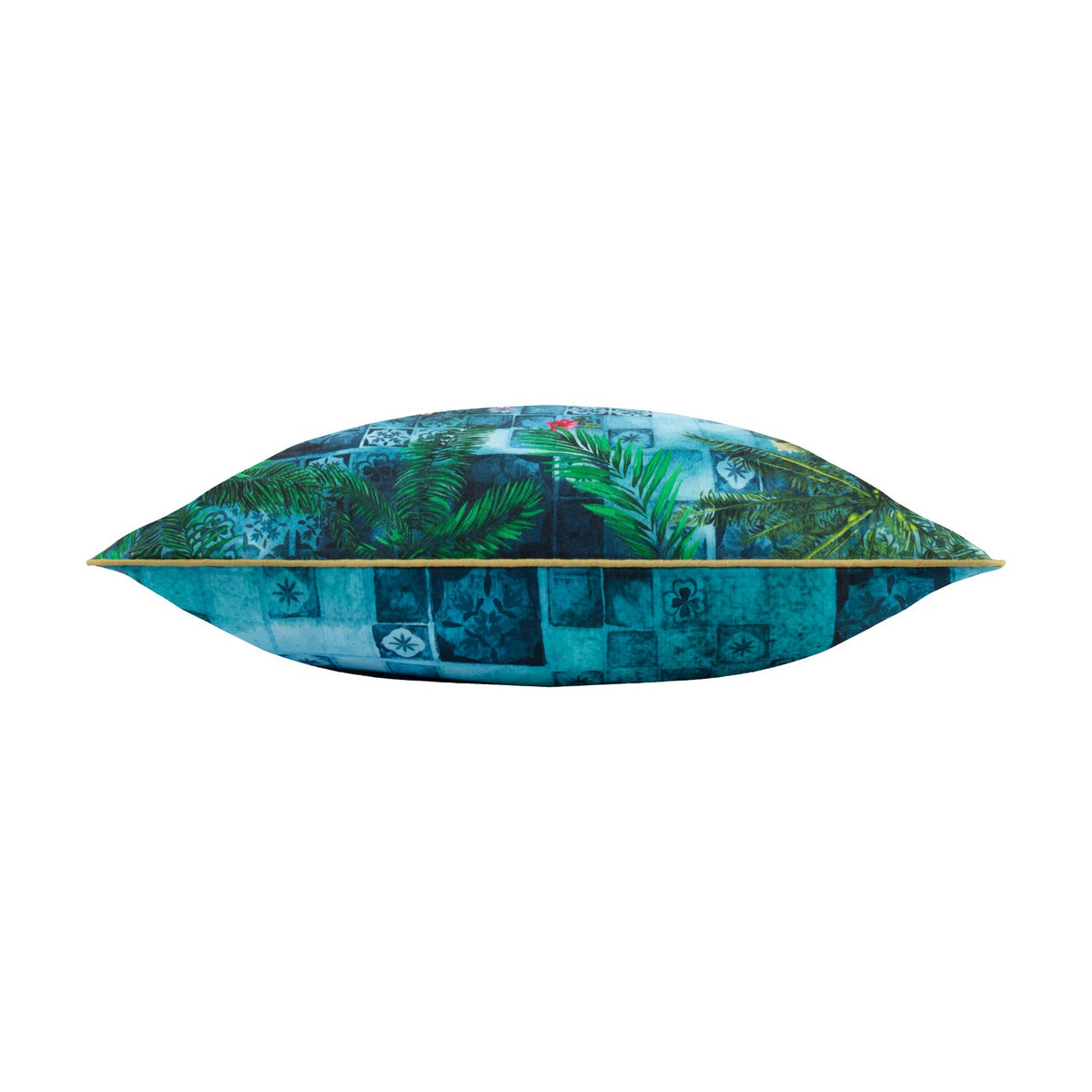 Side view of the Majorelle reversible polyester cushion in azure, showing tropical palm fronds over a blue Moroccan tile print with piped edge trim, set against a white background.
