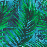 Majorelle Reversible Polyester Cushion in Azure, close-up of the green palm leaf print over a blue Moroccan tile background pattern.
