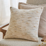 Malvern Jacquard Chenille Cushion in natural sandy tones with a textured woven pile, styled on an armchair alongside neutral scatter cushions.
