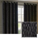 Manhattan Velvet Fully Lined Eyelet Curtains in charcoal, shown hung on a chrome pole in a living room window, with textured geometric cut-pile fabric and a matching swatch inset.