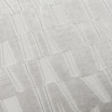 Close-up of the Manhattan Geometric Velvet Cushion in silver, showing a cut-velvet block and bar pattern with raised pile against a flatter woven ground.