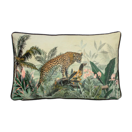 Manyara Animal Velvet Cushion, rectangular, with a printed jungle scene of a leopard among palm fronds and foliage in green and multicolour tones, edged with dark piping, on a white background.