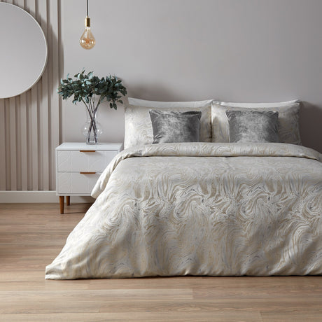 Marble Jacquard Abstract Duvet Cover Set in Oyster on a bed with grey velvet cushions, styled in a neutral bedroom with wooden flooring and a pendant light.