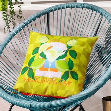 Square polyester outdoor cushion in lime green with a checked ground, printed margarita cocktail design, limes and "Margarita Time" text, shown on a teal woven chair.