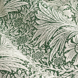 Close-up of Marigold Jacquard pencil pleat curtain fabric in leaf green, showing woven foliage and flower head pattern in deep green on a paler ground.