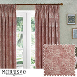 Marigold Jacquard pencil pleat curtains in russet, floral foliage pattern, hung by a French door in a living room with patterned wallpaper and framed prints.