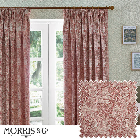 Marigold Jacquard pencil pleat curtains in russet, floral foliage pattern, hung by a French door in a living room with patterned wallpaper and framed prints.