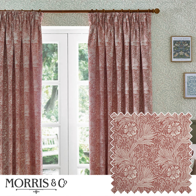 Marigold Jacquard pencil pleat curtains in russet, floral foliage pattern, hung by a French door in a living room with patterned wallpaper and framed prints.