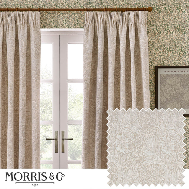 Marigold Jacquard Polyester pencil pleat curtains in stone, shown pleated on a wooden pole at a window, with a fabric swatch inset showing the raised floral jacquard weave.