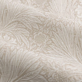 Close-up of Marigold Jacquard pencil pleat curtains in stone, showing woven leaf and sunburst floral pattern in raised jacquard texture on 100% polyester fabric.