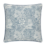 Square cushion in indigo blue jacquard velvet with a cream Marigold floral and foliage pattern by William Morris, finished with matching piped edging, shown on a plain white background.