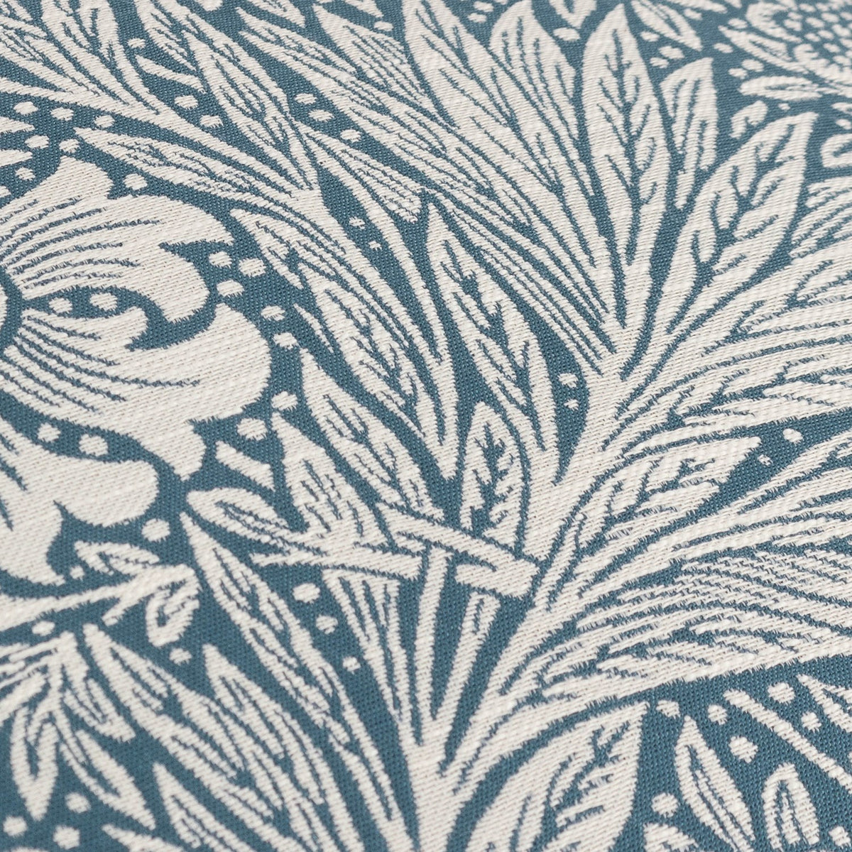 Close-up of Marigold Jacquard Velvet Cushion in indigo, showing cream marigold and foliage motifs woven into textured velvet fabric.