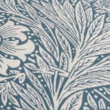 Close-up of Marigold Jacquard Velvet Cushion in indigo, showing cream marigold and foliage motifs woven into textured velvet fabric.