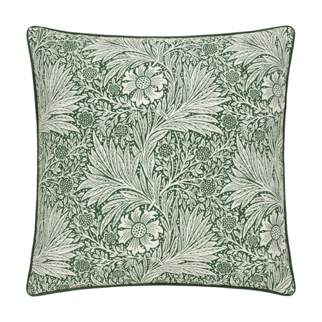 Square jacquard velvet cushion with the Marigold design, showing pale flowers and foliage woven into a deep leaf green ground, finished with matching piped edges on a plain white background.