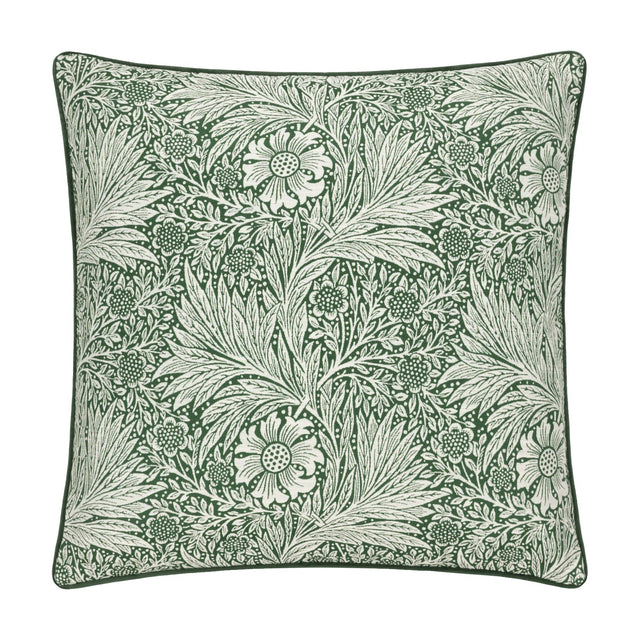 Square jacquard velvet cushion with the Marigold design, showing pale flowers and foliage woven into a deep leaf green ground, finished with matching piped edges on a plain white background.