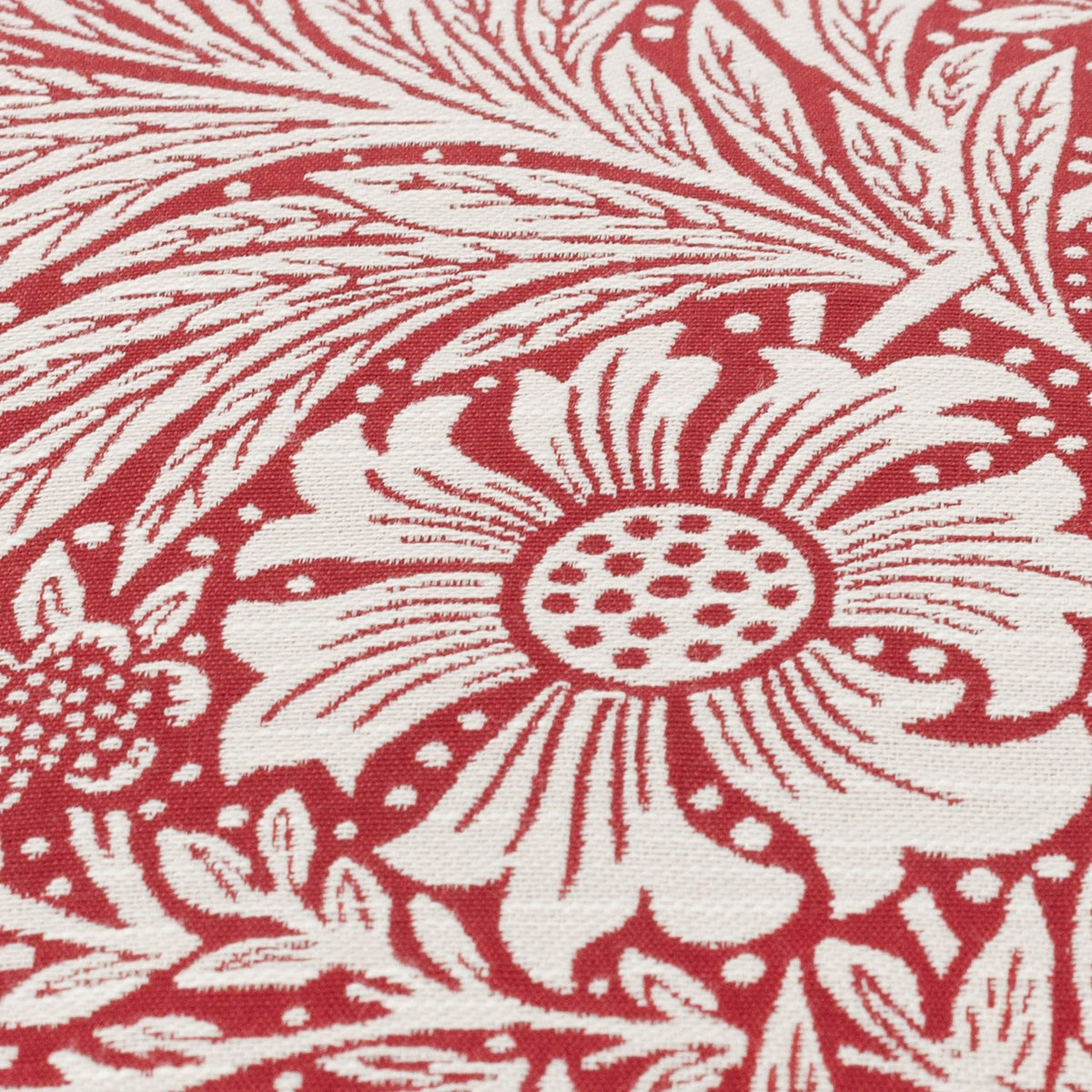 Close-up of the Marigold Jacquard Velvet Cushion in russet, showing a cream William Morris floral and foliage pattern woven into the textured fabric.