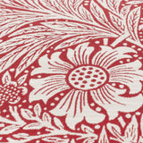 Close-up of the Marigold Jacquard Velvet Cushion in russet, showing a cream William Morris floral and foliage pattern woven into the textured fabric.