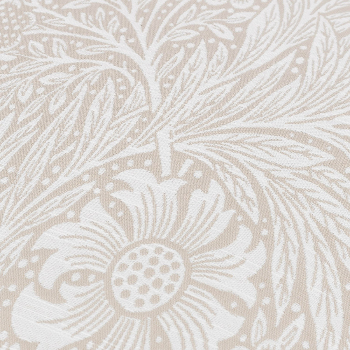 Close-up of the Marigold Jacquard Velvet Cushion in stone, showing a woven William Morris marigold and foliage design in white with a raised jacquard texture.
