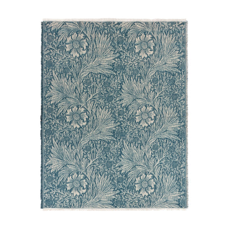 Marigold Jacquard Cotton Throw in indigo blue, showing a woven floral and leaf pattern with fringed edges, laid flat on a plain white background.