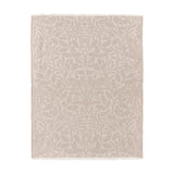 Marigold Jacquard Cotton Throw in stone, a rectangular jacquard-woven blanket with a tonal acorn and leaf pattern and fringed edges, shown on a plain white background.