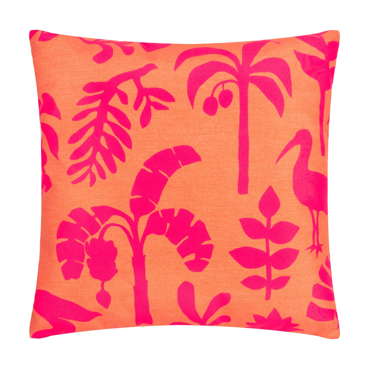 Marula Jungle polyester cushion in coral-orange with a bold pink tropical print of palm trees, banana leaves, ferns and a wading bird, shown square on a plain white background.