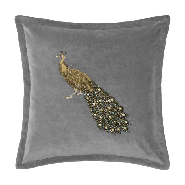 Mayura Animal Velvet Cushion in steel grey with a beaded peacock design, gold body and jewelled bugle-bead tail, square shape, on a white background.