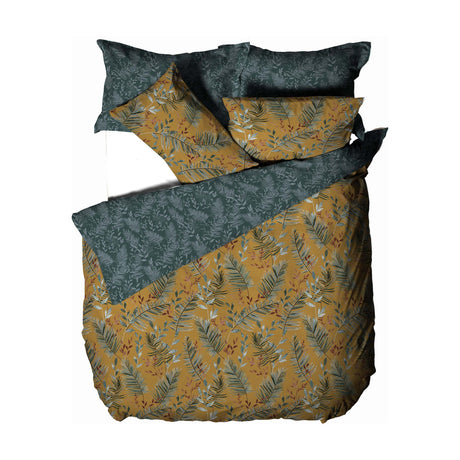 Mazari Printed Jungle Duvet Cover Set in mustard, featuring palm frond and leaf patterns with a reverse dark teal foliage print, shown folded with matching pillowcases on a white background.