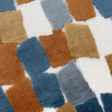 Metro Blocks Jacquard Velvet Cushion in Ginger, close-up of geometric brushstroke blocks in ginger, teal, denim blue, slate grey and mustard on a raised tufted pile against a cream ground.