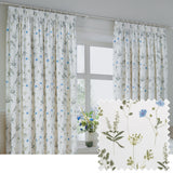 Meadow Floral Cotton Pencil Pleat Curtains in white with a scattered cornflower-blue and green floral print, shown hanging at a window, with a fabric swatch inset.