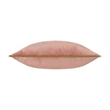 Meridian Plain Velvet Cushion in blush pink, shown side-on with gold piped edging along the seam, set against a plain white background.