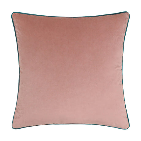 Meridian square cushion in plain blush pink velvet-feel fabric with a contrasting teal piped edge, shown on a plain white background.