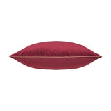 Meridian Plain Velvet Cushion in deep burgundy with contrasting slipper pink piped trim, shown side-on against a plain white background.