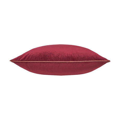 Meridian Plain Velvet Cushion in deep burgundy with contrasting slipper pink piped trim, shown side-on against a plain white background.