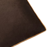 Close-up of the Meridian Plain Velvet Cushion in chocolate brown, showing dense velvet pile and a contrasting caramel piped edge trim.