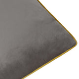 Close-up of the Meridian Plain Velvet Cushion in charcoal grey, showing the velvet-feel fabric and corner with moss green piped edging on a white background.