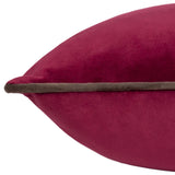 Close-up of the Meridian Plain Velvet Cushion in cranberry pink velvet with a contrasting mocha brown piped edge, shown plump and full against a white background.