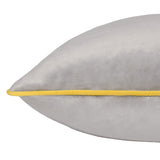 Meridian Plain Velvet Cushion in dove grey with a contrasting yellow piped edge, shown in close-up against a plain white background.