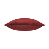 Meridian Plain Velvet Cushion in dark red velvet with a fir green piped trim edging the seam, shown side-on against a plain white background.
