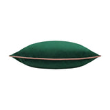 Meridian velvet cushion in emerald green, shown side-on with a blush pink piped edge trim, plain fabric front and reverse, on a white background.