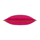 Meridian Plain Velvet Cushion in hot pink with a contrasting lime green piped edge, shown lying flat on a plain white background.