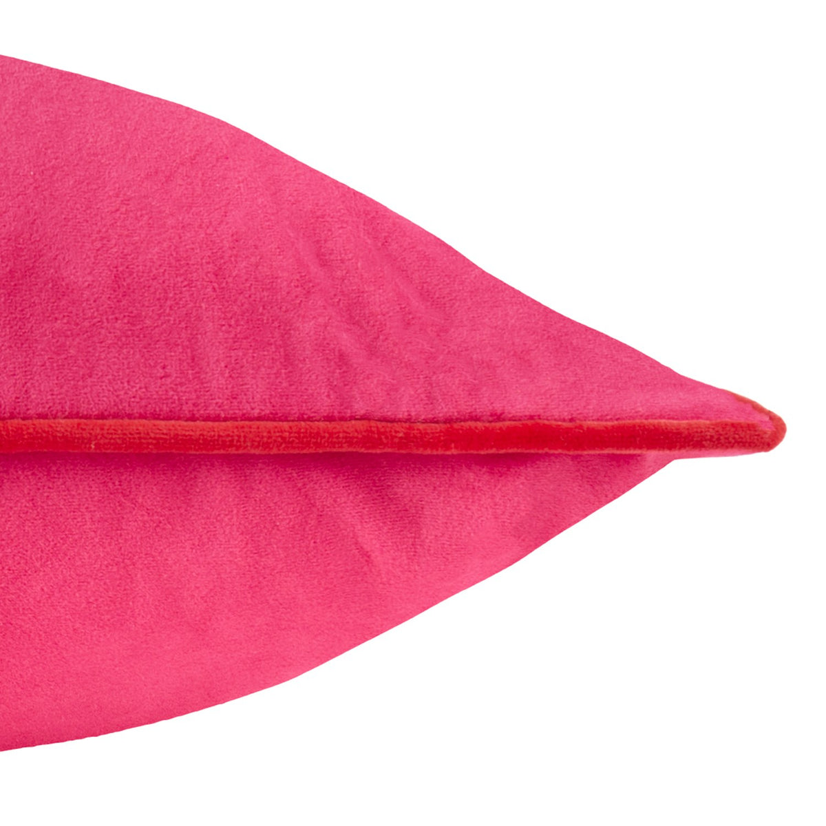 Close-up of the Meridian Plain Velvet Cushion in hot pink velvet with contrasting red piped edge trim, shown against a plain white background.