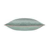 Meridian Plain Velvet Cushion in mineral blue with contrasting blush pink piped edge, shown side-on against a plain white background.